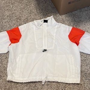 White and red vintage looking Nike windbreaker. Size medium womens. Never worn